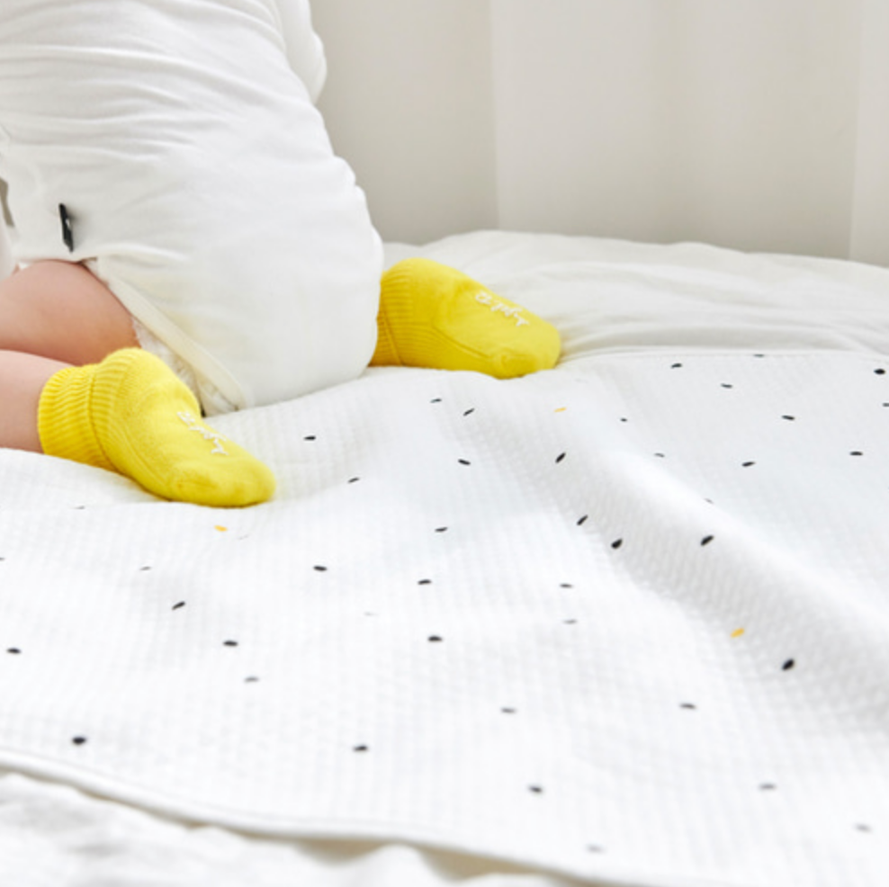 Baby on Little Dot waterproof changing mat with yellow socks, 100% cotton and polyester, 65x85 cm made in Korea.