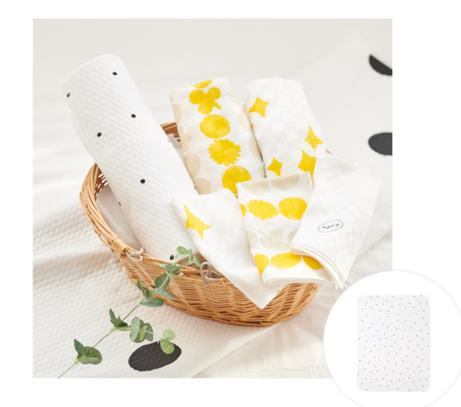 Little dot waterproof mattress and diaper changing mat, made in Korea, 65x85 cm, cotton and polyester, shown in a basket with designs