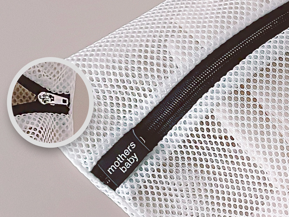 Close-up view of a multipurpose laundry net bag with a zipper and "mothers baby" label, made in Korea. Size: 225 x 30 cm.